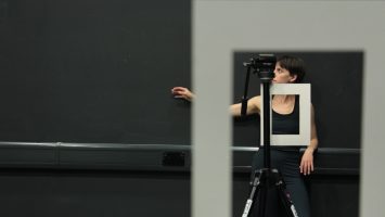 Various white frames are laid over an image of a dancer stood behind a camera