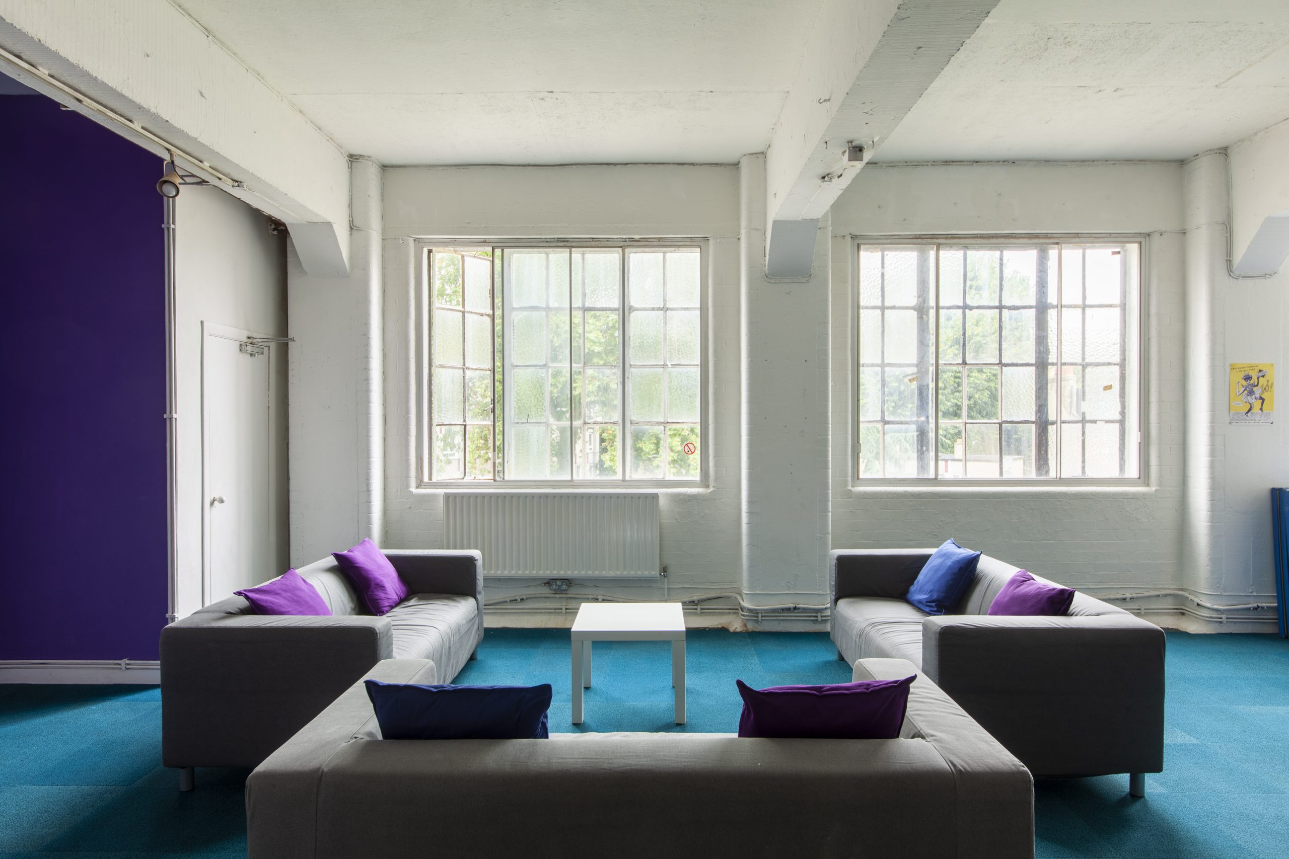 Image of three grey sofas in the Chisenhale Dance Space lounge